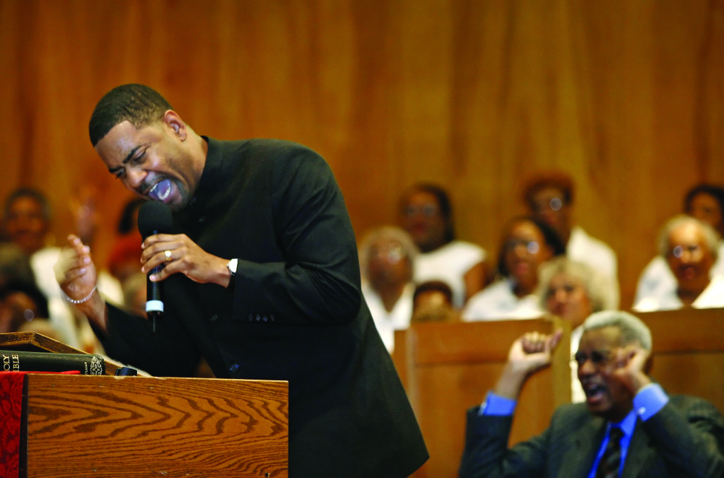 For Diana Keough Story -- Left, Rev. Otis Moss, III preaches during the annual revival at Olivet Institutional Baptist Church in Cleveland while his father, Pastor Otis Moss, Jr. sits behind him. March 21, 2007 (Lonnie Timmons III/Plain Dealer)